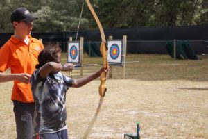 Rawa Camp - Participant doing archery at Forest Adventures